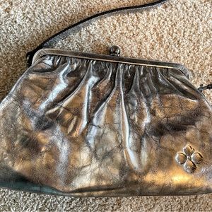 HOBO frame crossbody in silver metallic leather.